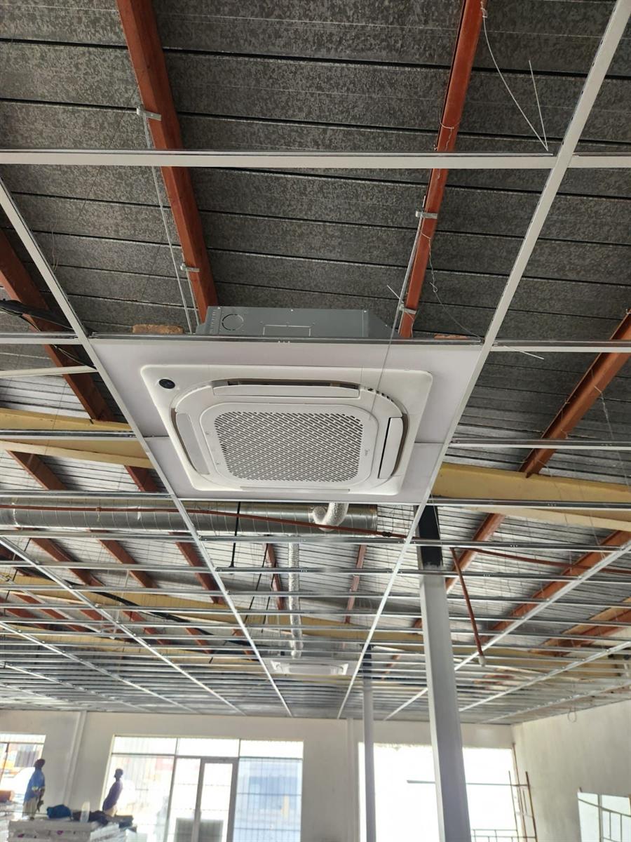 Ceiling cassette set into a suspended ceiling in an office