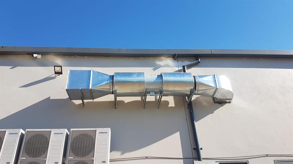 External spiral ducting running to a Samsung VRF condenser bank