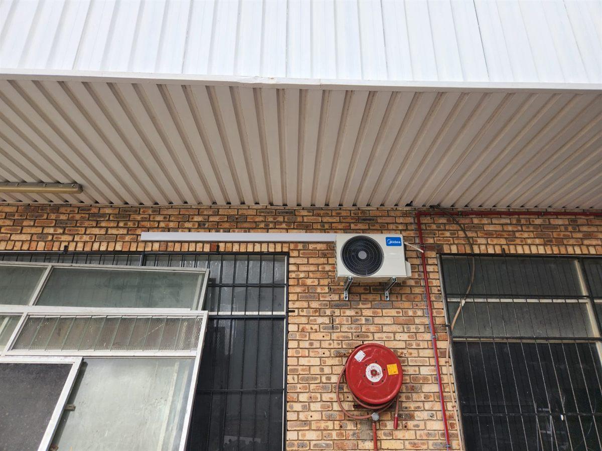 Wall mounted split air conditioner outdoor unit on a commercial building